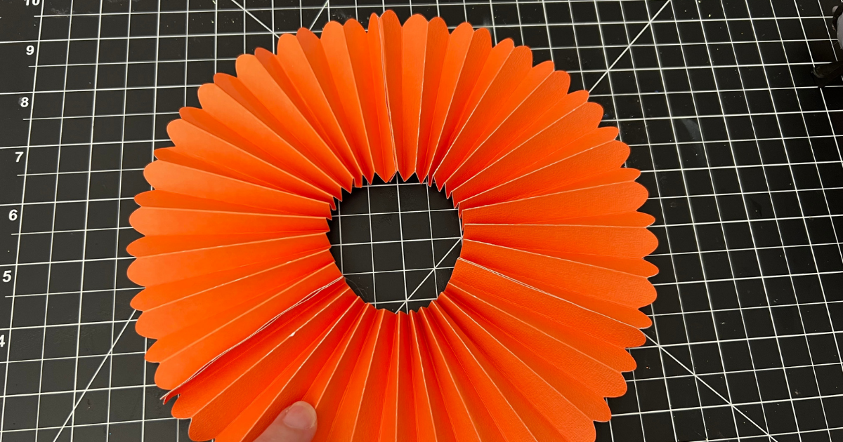 paper rosette with Cricut glued together 