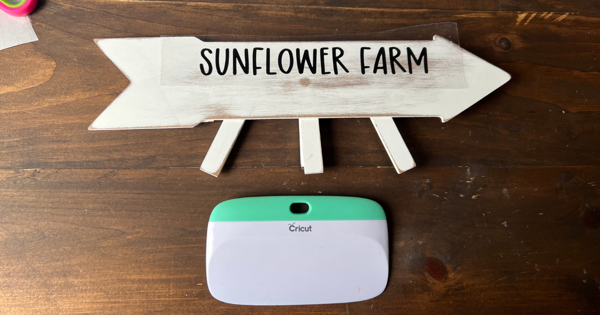 Add the vinyl to the Dollar Tree sunflower farm sign 