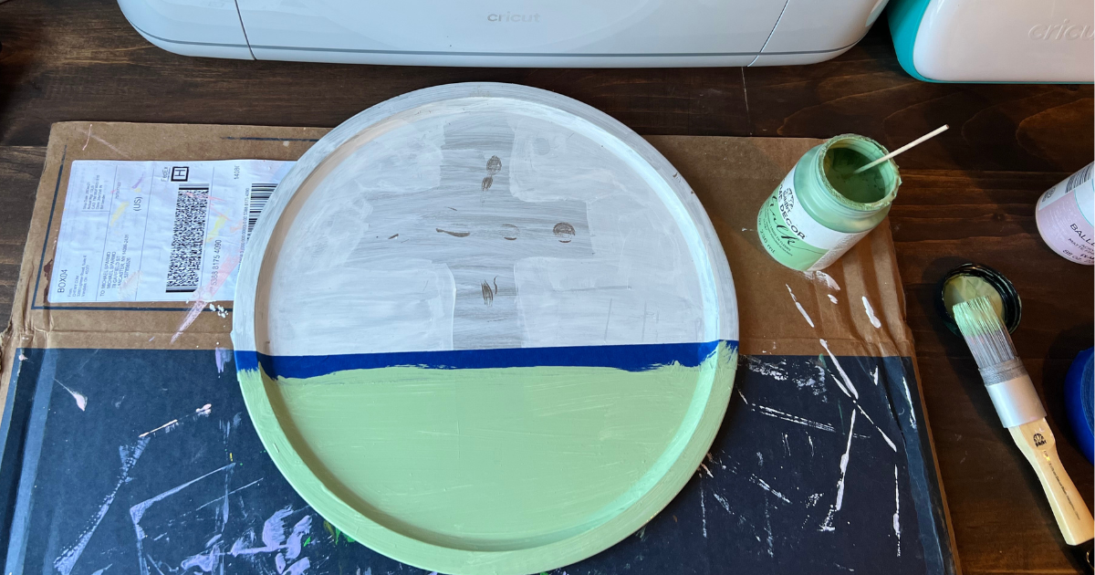 Painting the dollar tree pizza pan craft